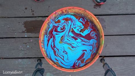 Magical swirling paint on marble surface